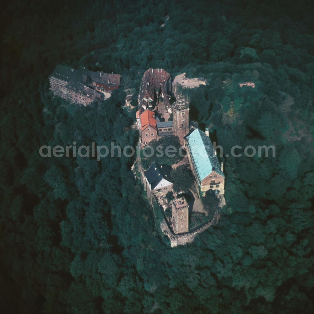 Aerial image Eisenach - Blick auf die Wartburg-Stiftung Eisenach bei Eisenach in Thüringen. Die Burg stammt aus dem 11. Jahrhundert, besteht aber in ihrer heutigen Erscheinungsform seit Mitte des 19. Jahrhunderts, als sie unter Einbeziehung weniger erhaltener Teile neu erbaut wurde. Seit 1999 gehört sie zum UNESCO-Weltkulturerbe. View of the Wartburg-Stiftung Eisenach near Eisenach in Thuringia. The castle dates from the 11th Century, but has its present form since the mid-19th Century. Since 1999 it is a UNESCO World Heritage Site.