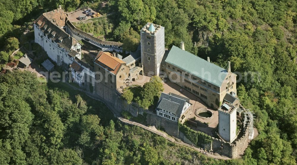 Aerial photograph Eisenach - Blick auf die Wartburg-Stiftung Eisenach bei Eisenach in Thüringen. Die Burg stammt aus dem 11. Jahrhundert, besteht aber in ihrer heutigen Erscheinungsform seit Mitte des 19. Jahrhunderts, als sie unter Einbeziehung weniger erhaltener Teile neu erbaut wurde. Seit 1999 gehört sie zum UNESCO-Weltkulturerbe. View of the Wartburg-Stiftung Eisenach near Eisenach in Thuringia. The castle dates from the 11th Century, but has its present form since the mid-19th Century. Since 1999 it is a UNESCO World Heritage Site.