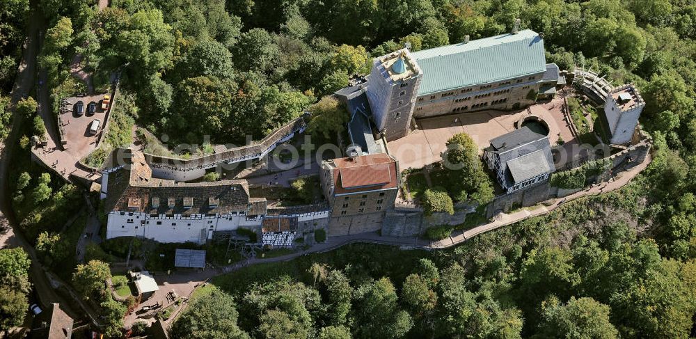 Eisenach from the bird's eye view: Blick auf die Wartburg-Stiftung Eisenach bei Eisenach in Thüringen. Die Burg stammt aus dem 11. Jahrhundert, besteht aber in ihrer heutigen Erscheinungsform seit Mitte des 19. Jahrhunderts, als sie unter Einbeziehung weniger erhaltener Teile neu erbaut wurde. Seit 1999 gehört sie zum UNESCO-Weltkulturerbe. View of the Wartburg-Stiftung Eisenach near Eisenach in Thuringia. The castle dates from the 11th Century, but has its present form since the mid-19th Century. Since 1999 it is a UNESCO World Heritage Site.