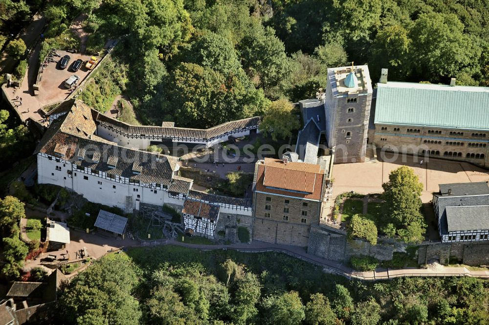 Aerial image Eisenach - Blick auf die Wartburg-Stiftung Eisenach bei Eisenach in Thüringen. Die Burg stammt aus dem 11. Jahrhundert, besteht aber in ihrer heutigen Erscheinungsform seit Mitte des 19. Jahrhunderts, als sie unter Einbeziehung weniger erhaltener Teile neu erbaut wurde. Seit 1999 gehört sie zum UNESCO-Weltkulturerbe. View of the Wartburg-Stiftung Eisenach near Eisenach in Thuringia. The castle dates from the 11th Century, but has its present form since the mid-19th Century. Since 1999 it is a UNESCO World Heritage Site.