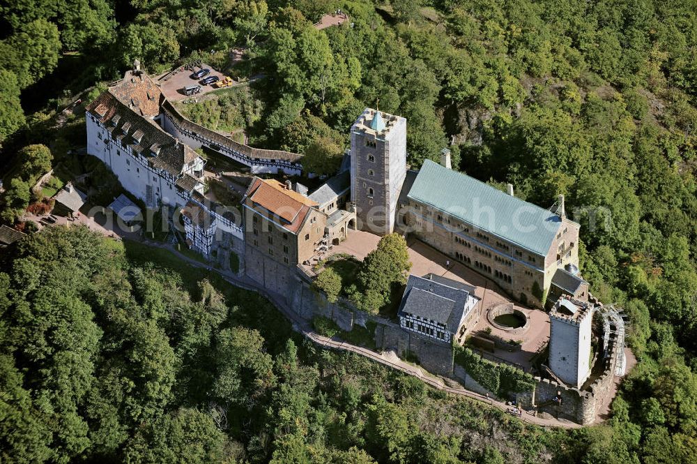 Aerial photograph Eisenach - Blick auf die Wartburg-Stiftung Eisenach bei Eisenach in Thüringen. Die Burg stammt aus dem 11. Jahrhundert, besteht aber in ihrer heutigen Erscheinungsform seit Mitte des 19. Jahrhunderts, als sie unter Einbeziehung weniger erhaltener Teile neu erbaut wurde. Seit 1999 gehört sie zum UNESCO-Weltkulturerbe. View of the Wartburg-Stiftung Eisenach near Eisenach in Thuringia. The castle dates from the 11th Century, but has its present form since the mid-19th Century. Since 1999 it is a UNESCO World Heritage Site.