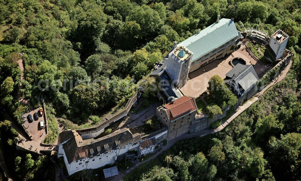 Eisenach from the bird's eye view: Blick auf die Wartburg-Stiftung Eisenach bei Eisenach in Thüringen. Die Burg stammt aus dem 11. Jahrhundert, besteht aber in ihrer heutigen Erscheinungsform seit Mitte des 19. Jahrhunderts, als sie unter Einbeziehung weniger erhaltener Teile neu erbaut wurde. Seit 1999 gehört sie zum UNESCO-Weltkulturerbe. View of the Wartburg-Stiftung Eisenach near Eisenach in Thuringia. The castle dates from the 11th Century, but has its present form since the mid-19th Century. Since 1999 it is a UNESCO World Heritage Site.