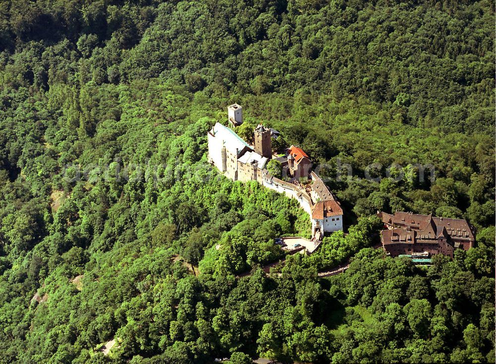 Aerial photograph Eisenach - Blick auf die Wartburg-Stiftung Eisenach bei Eisenach in Thüringen. Die Burg stammt aus dem 11. Jahrhundert, besteht aber in ihrer heutigen Erscheinungsform seit Mitte des 19. Jahrhunderts, als sie unter Einbeziehung weniger erhaltener Teile neu erbaut wurde. Seit 1999 gehört sie zum UNESCO-Weltkulturerbe. View of the Wartburg-Stiftung Eisenach near Eisenach in Thuringia. The castle dates from the 11th Century, but has its present form since the mid-19th Century. Since 1999 it is a UNESCO World Heritage Site.