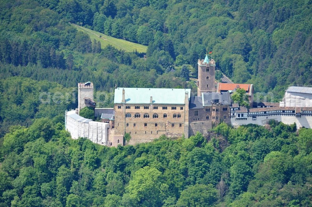 Aerial photograph Eisenach - View of the Wartburg-Stiftung Eisenach near Eisenach in Thuringia. The castle dates from the 11th Century, but has its present form since the mid-19th Century. Since 1999 it is a UNESCO World Heritage Site