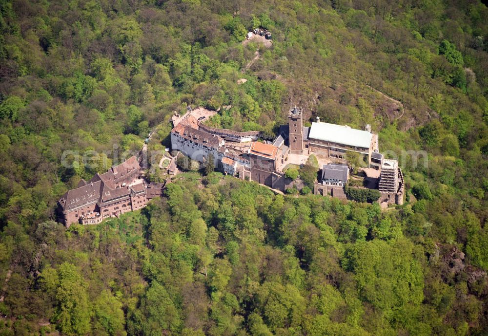 Aerial photograph Eisenach - Blick auf die Wartburg-Stiftung Eisenach bei Eisenach in Thüringen. Die Burg stammt aus dem 11. Jahrhundert, besteht aber in ihrer heutigen Erscheinungsform seit Mitte des 19. Jahrhunderts, als sie unter Einbeziehung weniger erhaltener Teile neu erbaut wurde. Seit 1999 gehört sie zum UNESCO-Weltkulturerbe. View of the Wartburg-Stiftung Eisenach near Eisenach in Thuringia. The castle dates from the 11th Century, but has its present form since the mid-19th Century. Since 1999 it is a UNESCO World Heritage Site.