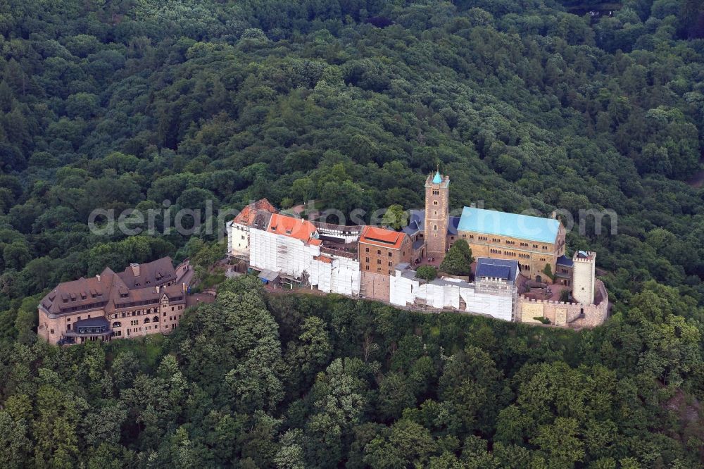 Aerial image Eisenach - View of the Wartburg-Stiftung Eisenach near Eisenach in Thuringia. The castle dates from the 11th Century, but has its present form since the mid-19th Century. Since 1999 it is a UNESCO World Heritage Site