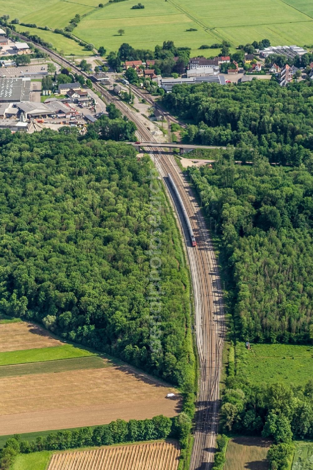 Aerial image Riegel am Kaiserstuhl - Maintenance work on a rail track and overhead wiring harness in the route network of the Deutsche Bahn in Riegel am Kaiserstuhl in the state Baden-Wuerttemberg, Germany