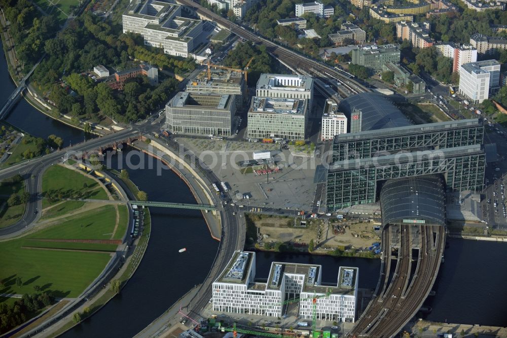 Berlin from above - Washington Square and the main station of the railway in Berlin in Germany. The square and the station are located in the urban development area of Lehrter Stadtquartier where several building projects are undertaken