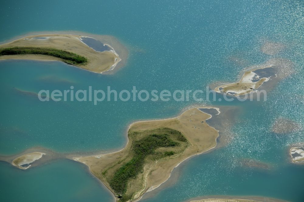 Aerial photograph Laußig - Water landscape on gravel surface mining the gravel pit of Xella Deutschland GmbH in Laussig in Saxony