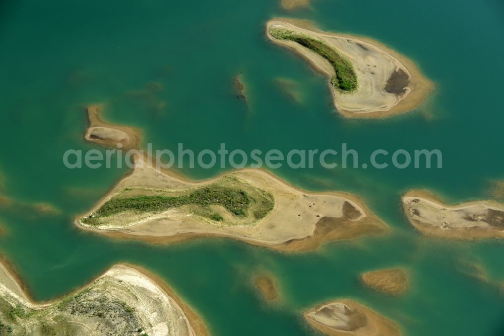 Aerial photograph Laußig - Water landscape on gravel surface mining the gravel pit of Xella Deutschland GmbH in Laussig in Saxony