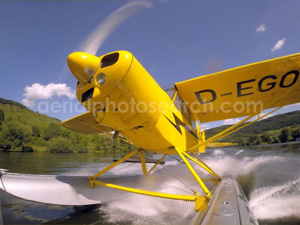 Aerial image Zeltingen-Rachtig - Seaplane Piper PA-18 Super Cub on the Moselle with pines in Zeltingen in the state Rhineland-Palatinate. No use for reports on aviation accidents