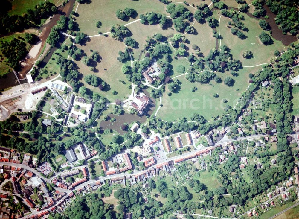 Bad Muskau from above - Building and castle park systems of water castle on Schlossstrasse in Fuerst-Pueckler-Park in Bad Muskau in the state Saxony, Germany