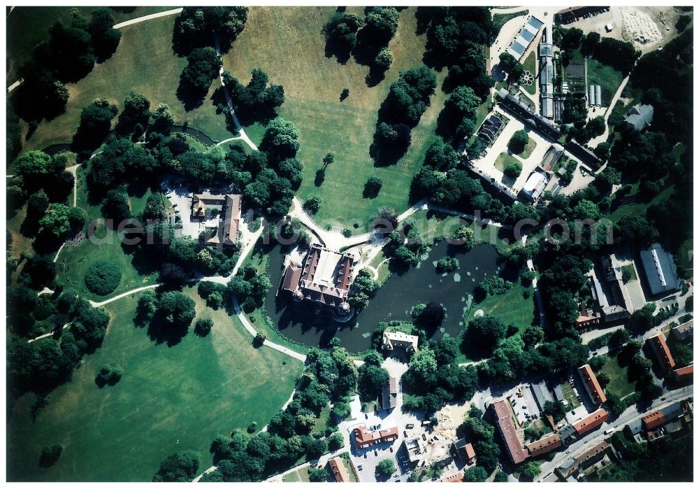 Bad Muskau from the bird's eye view: Building and castle park systems of water castle on Schlossstrasse in Fuerst-Pueckler-Park in Bad Muskau in the state Saxony, Germany