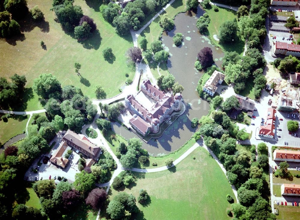 Bad Muskau from above - Building and castle park systems of water castle on Schlossstrasse in Fuerst-Pueckler-Park in Bad Muskau in the state Saxony, Germany