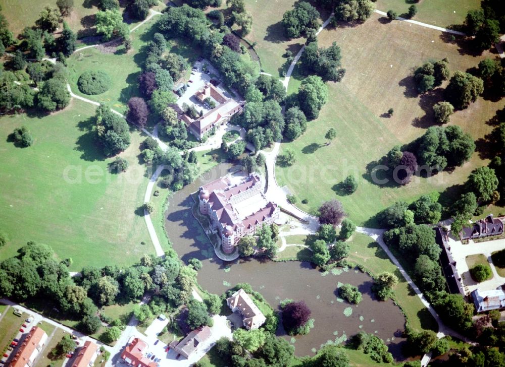 Bad Muskau from the bird's eye view: Building and castle park systems of water castle on Schlossstrasse in Fuerst-Pueckler-Park in Bad Muskau in the state Saxony, Germany