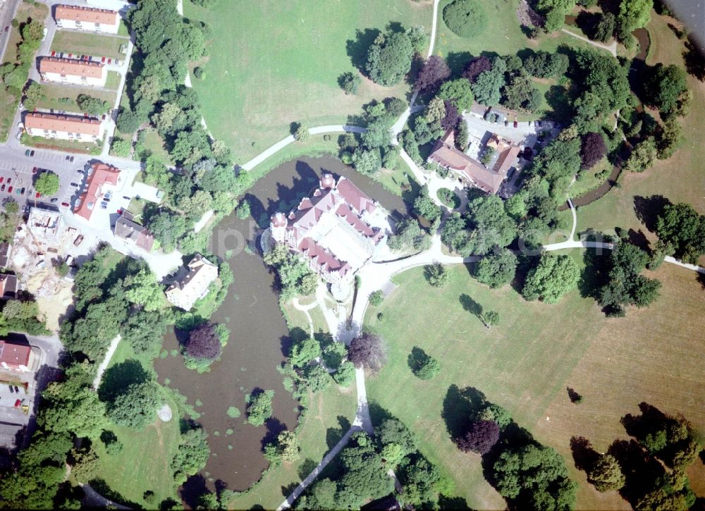 Bad Muskau from above - Building and castle park systems of water castle on Schlossstrasse in Fuerst-Pueckler-Park in Bad Muskau in the state Saxony, Germany