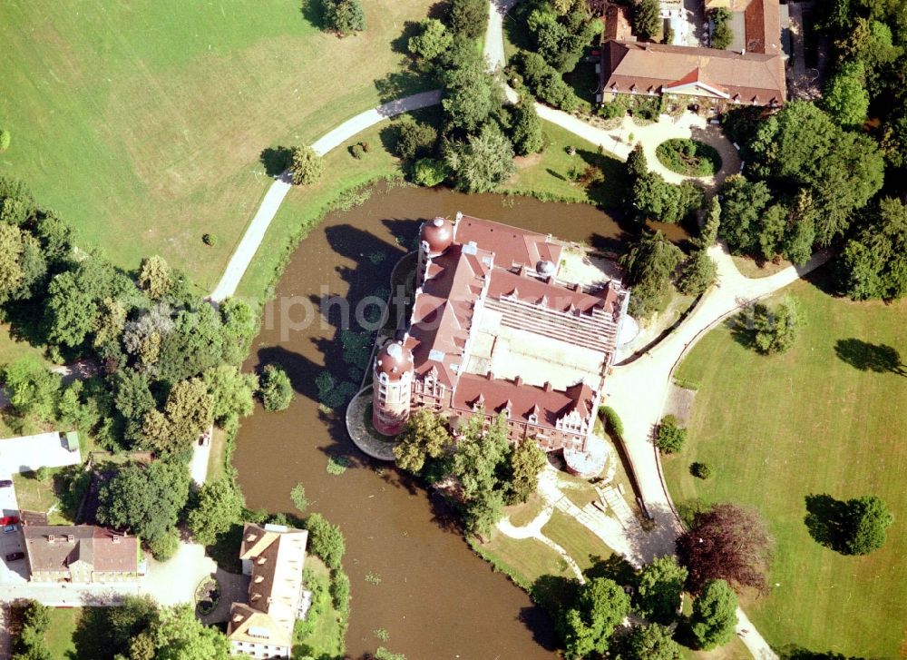 Aerial image Bad Muskau - Building and castle park systems of water castle on Schlossstrasse in Fuerst-Pueckler-Park in Bad Muskau in the state Saxony, Germany