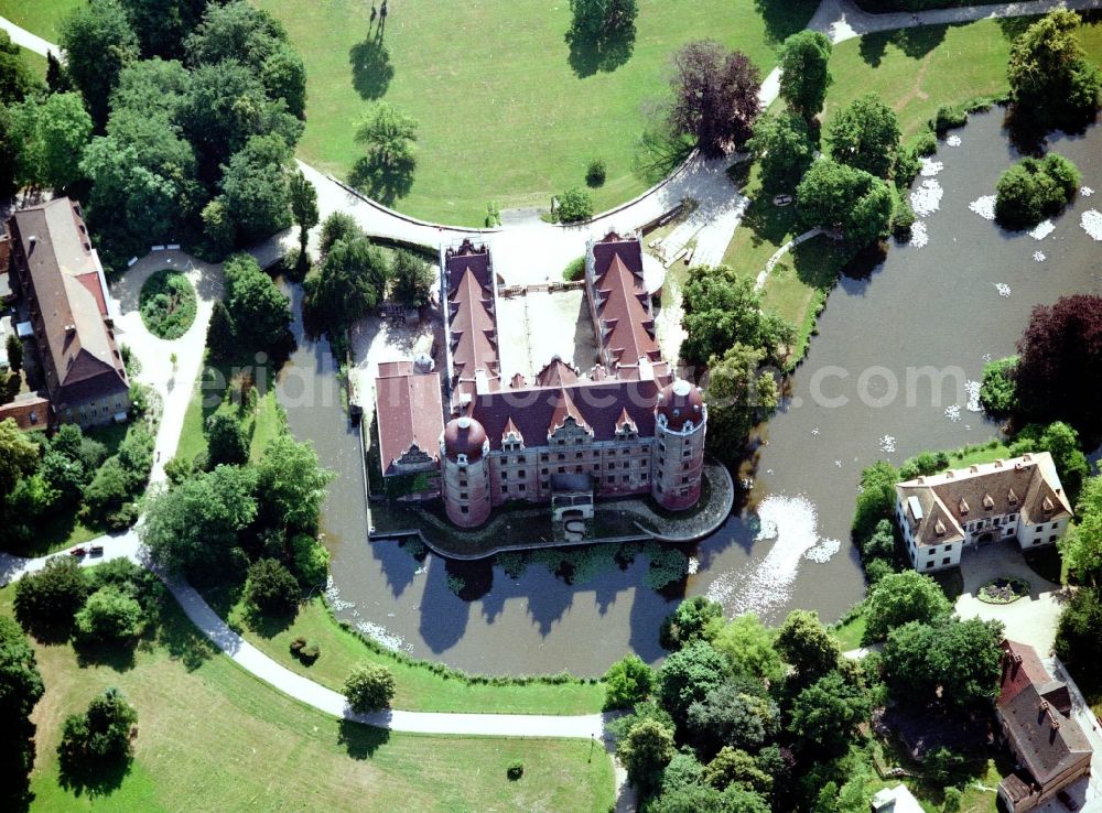 Bad Muskau from above - Building and castle park systems of water castle on Schlossstrasse in Fuerst-Pueckler-Park in Bad Muskau in the state Saxony, Germany