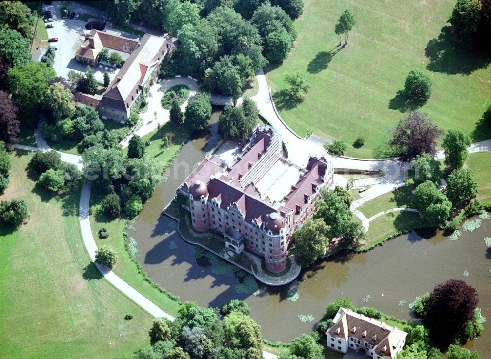 Bad Muskau from the bird's eye view: Building and castle park systems of water castle on Schlossstrasse in Fuerst-Pueckler-Park in Bad Muskau in the state Saxony, Germany