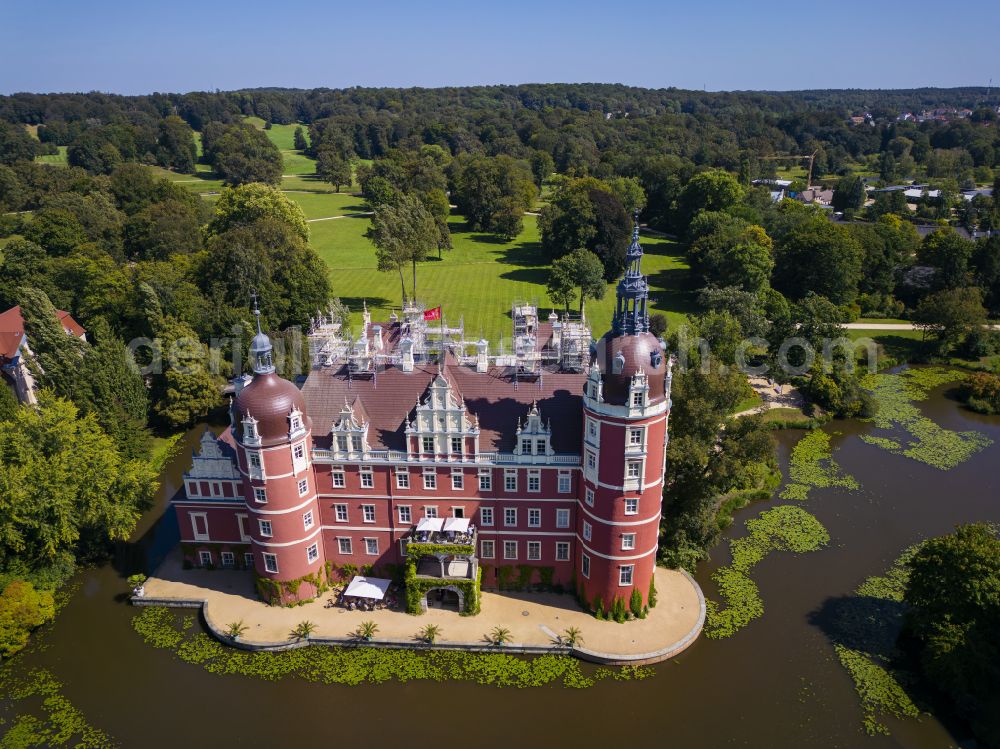 Bad Muskau from above - Building and castle park systems of water castle on Schlossstrasse in Fuerst-Pueckler-Park in Bad Muskau in the state Saxony, Germany