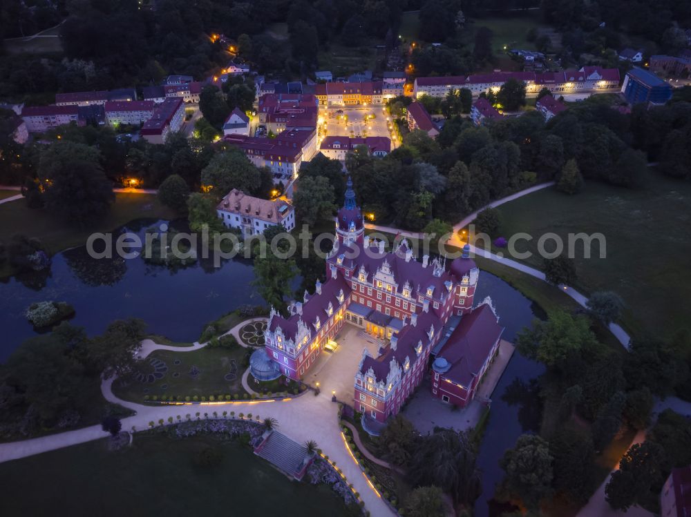 Bad Muskau from above - Building and castle park systems of water castle on Schlossstrasse in Fuerst-Pueckler-Park in Bad Muskau in the state Saxony, Germany