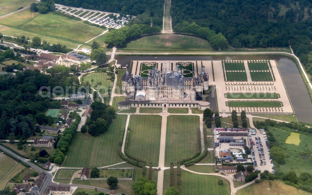 Chambord from the bird's eye view: Building and castle park systems of water castle Chateau de Chambord on street Le Chateau in Chambord in Centre-Val de Loire, France