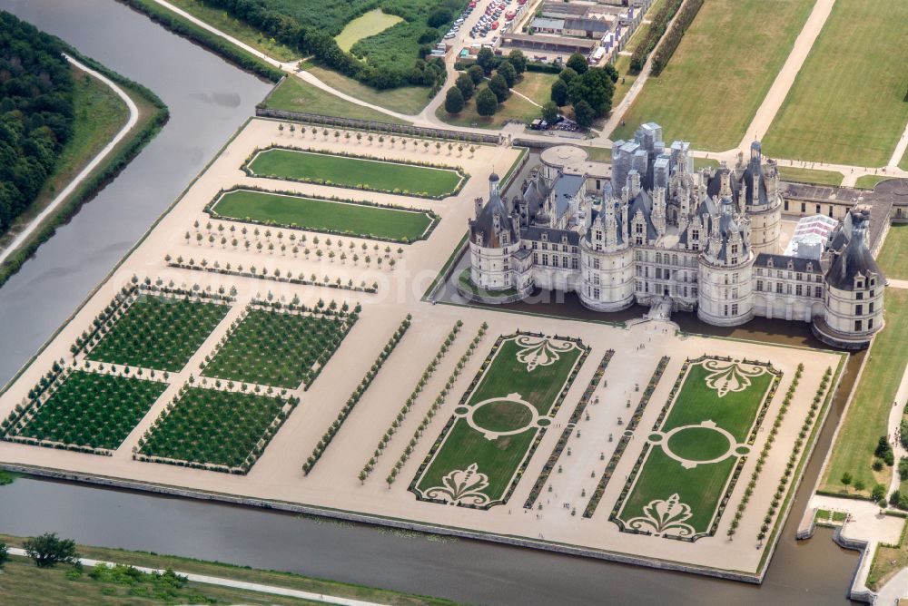 Aerial image Chambord - Building and castle park systems of water castle Chateau de Chambord on street Le Chateau in Chambord in Centre-Val de Loire, France