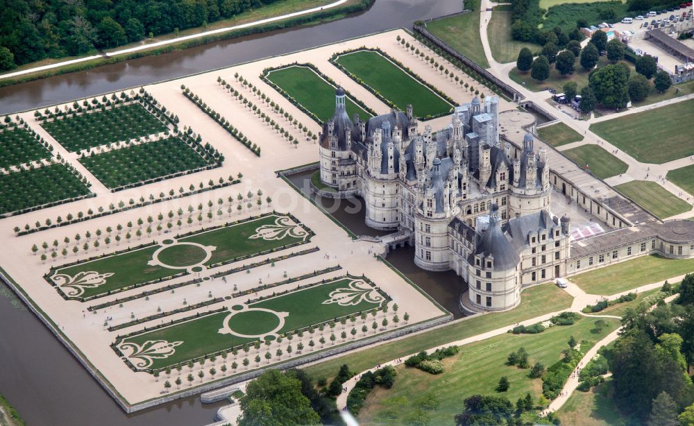 Chambord from above - Building and castle park systems of water castle Chateau de Chambord on street Le Chateau in Chambord in Centre-Val de Loire, France