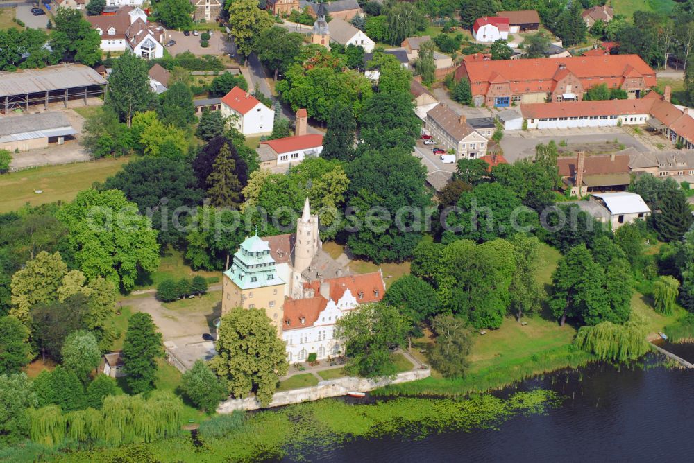 Groß Leuthen from above - Building and castle park systems of water castle in of Maerkischen Heide in Gross Leuthen in the state Brandenburg, Germany