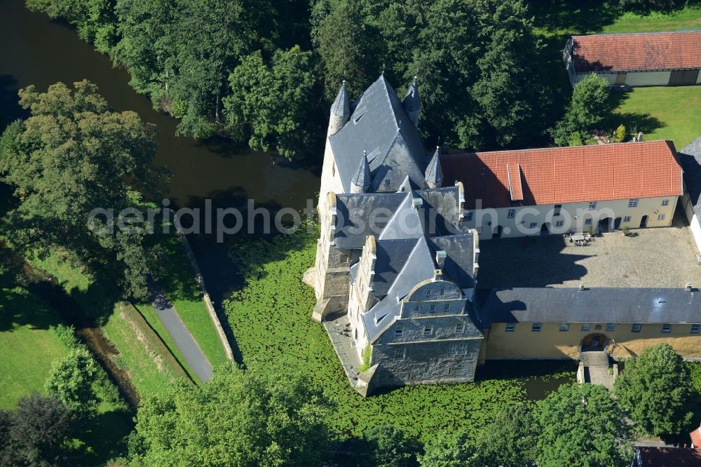 Aerial image Schledehausen - Building and castle park systems of water castle Schelenburg in Schledehausen in the state Lower Saxony