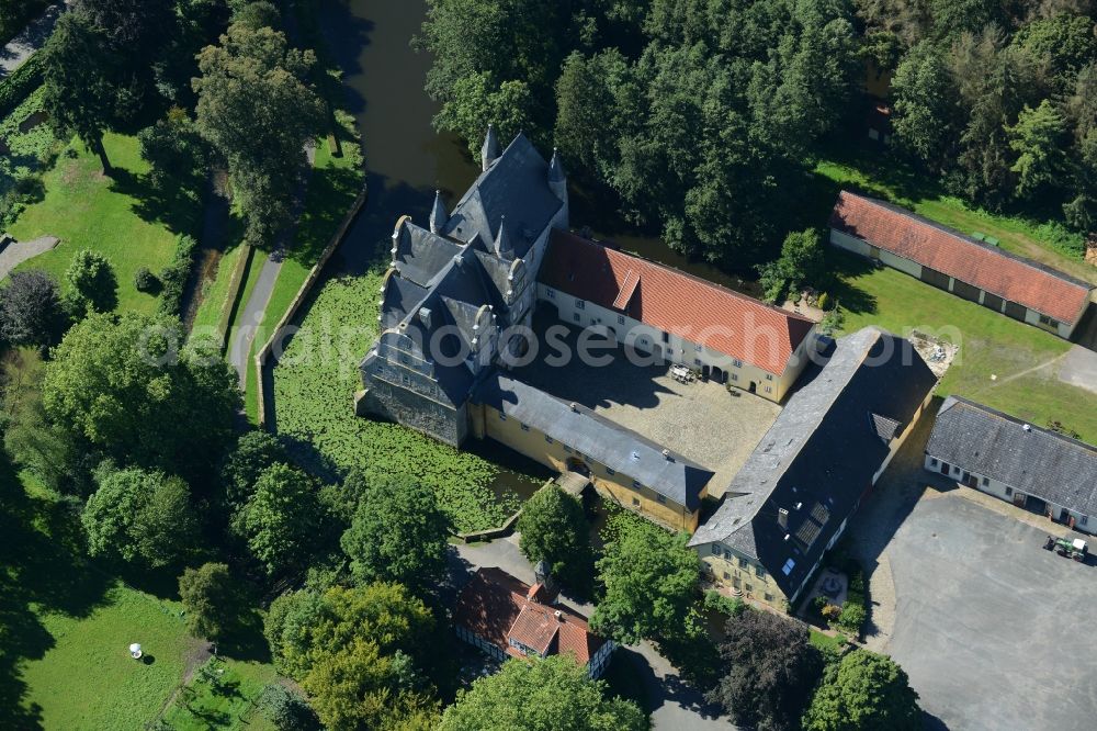 Aerial image Schledehausen - Building and castle park systems of water castle Schelenburg in Schledehausen in the state Lower Saxony