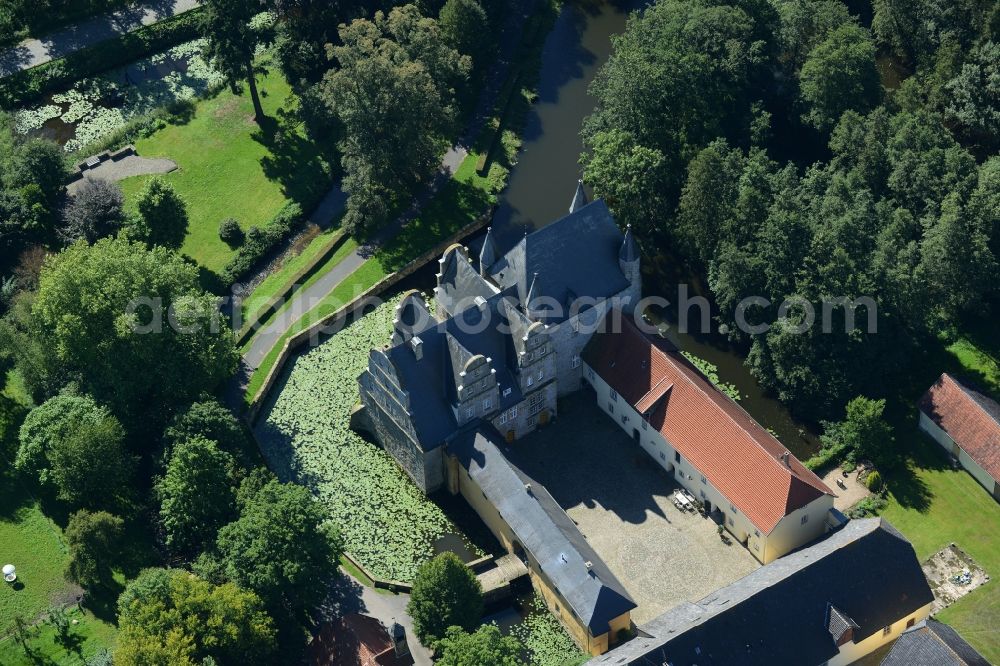 Aerial photograph Schledehausen - Building and castle park systems of water castle Schelenburg in Schledehausen in the state Lower Saxony