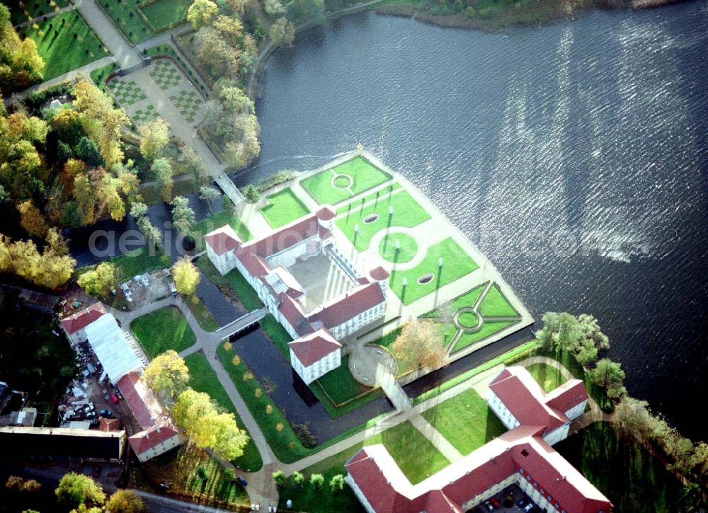 Rheinsberg from the bird's eye view: Building and castle park systems of water castle Rheinsberg in Rheinsberg in the state Brandenburg