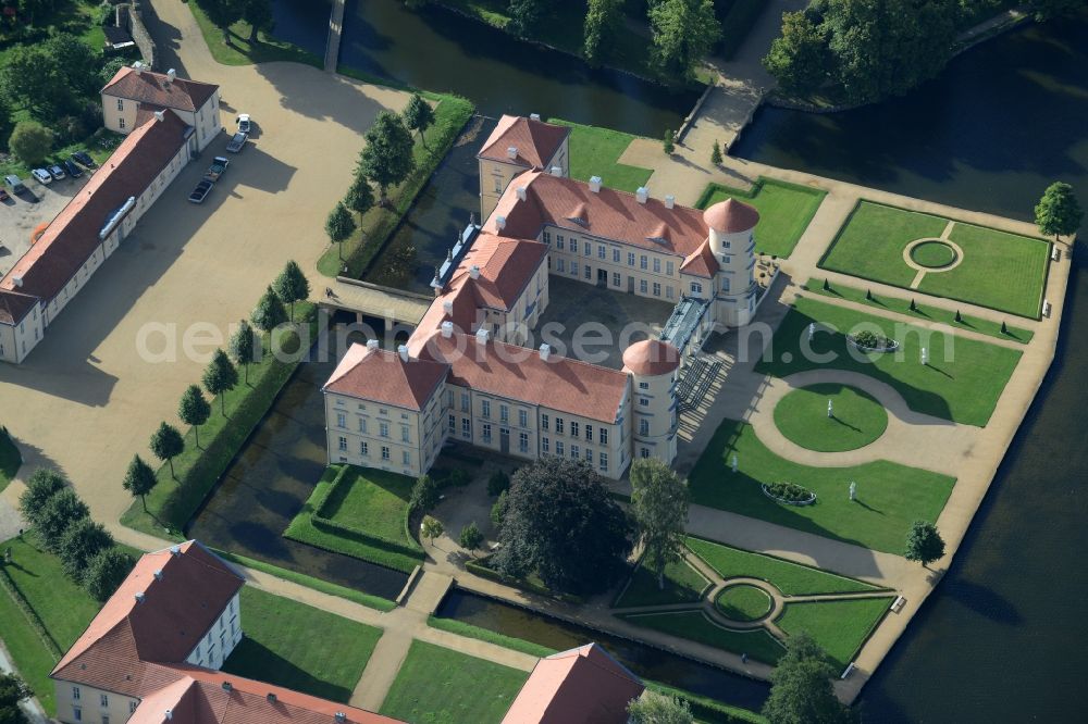 Rheinsberg from the bird's eye view: Building and castle park systems of water castle Schloss Rheinsberg in Rheinsberg in the state Brandenburg