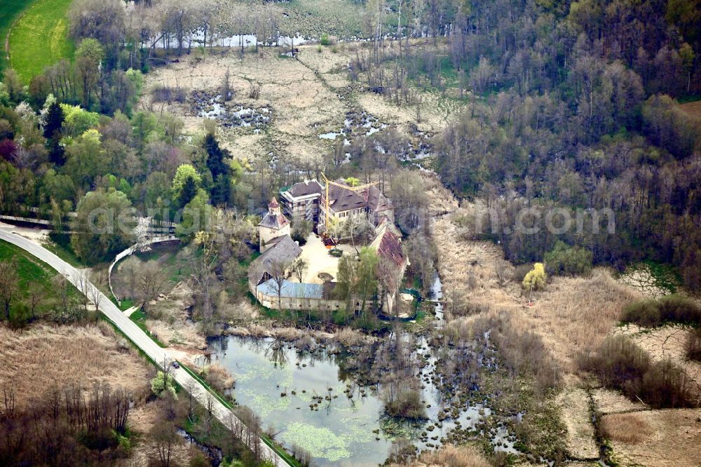 Aerial image Bergen - Building and castle park systems of water castle Syburg in Bergen in the state Bavaria, Germany