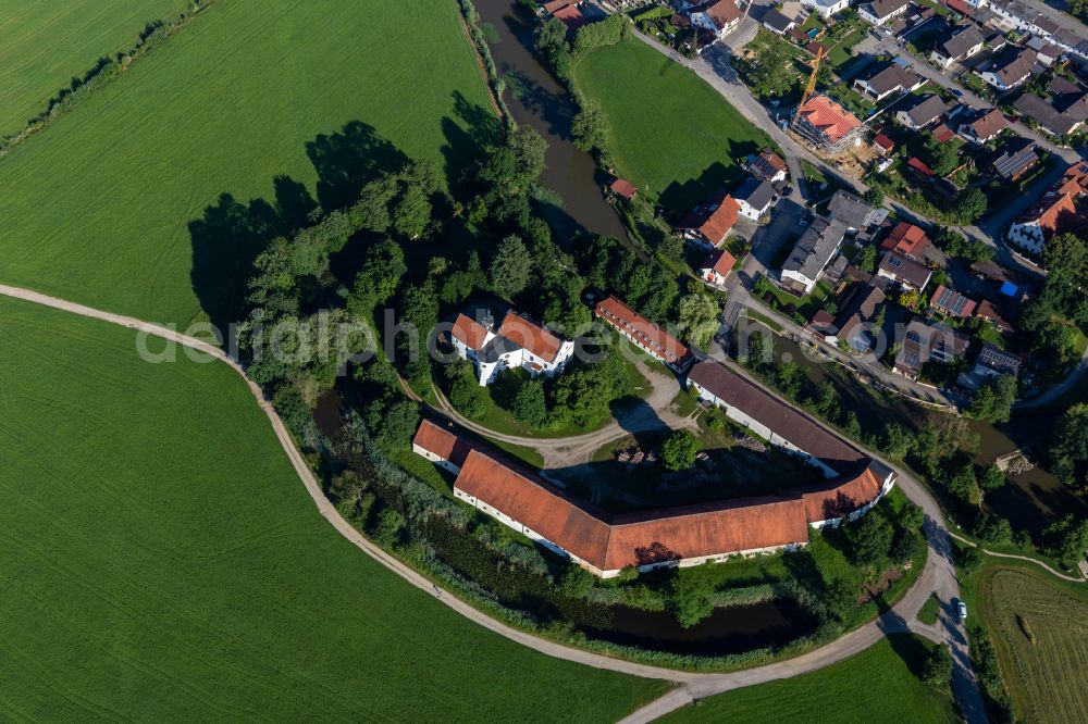 Aham from above - Building and castle park systems of water castle on the river Vils in Aham in the state Bavaria, Germany