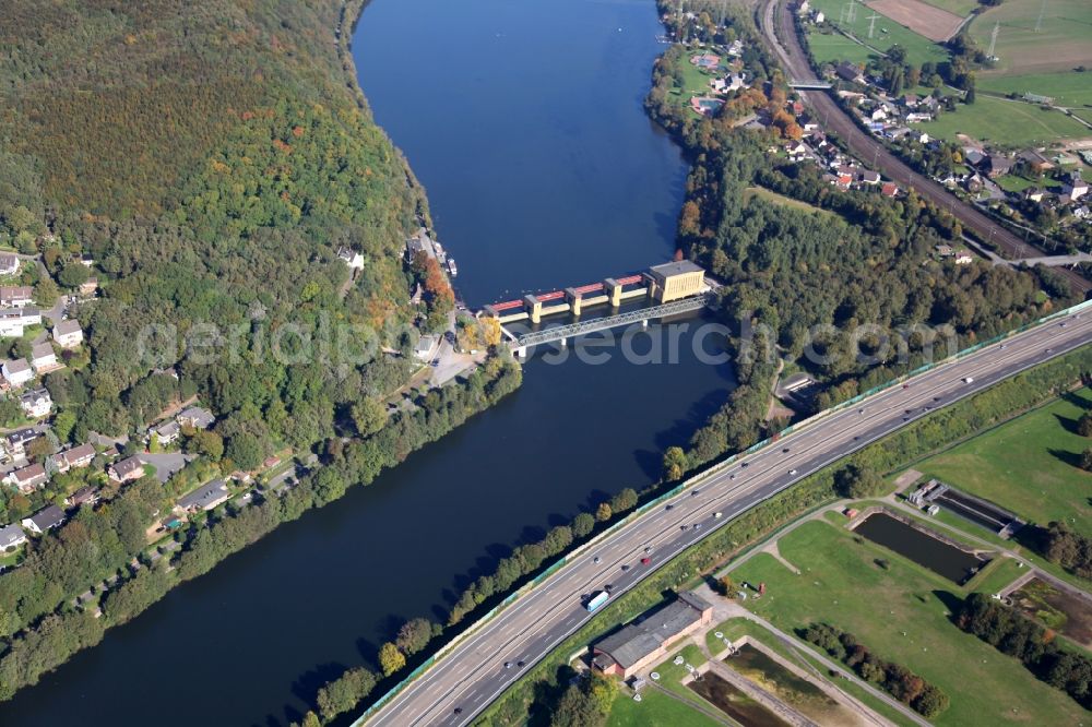 Hagen from above - Hydropower plant at the end of Hengsteysees over the Ruhr. Forest areas of steep slope surrounded the waters. Furthermore, the Federal Highway 1 BAB 1 runs along the Ruhr. The lake is located in Hagen in North Rhine-Westphalia