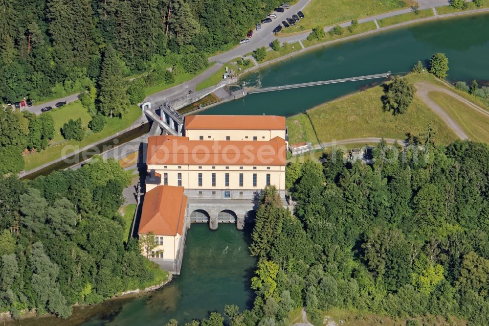 Straßlach-Dingharting from above - Structure and dams of the waterworks and hydroelectric power plant MNuehltal in Strasslach-Dingharting in the state Bavaria Protected monument and dams of the hydropower plant Muehltal in Muehltal channel near Strasslach-Dingharting in the state Bavaria. In addition to the power plant, the longest raft slide in Europe is a tourist attraction for the passengers of the excursion rafts on the way from Wolfratshausen to Munich. In the background Chapel of St. Ulrich and Gasthaus zur Muehle