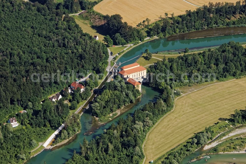 Straßlach-Dingharting from the bird's eye view: Structure and dams of the waterworks and hydroelectric power plant MNuehltal in Strasslach-Dingharting in the state Bavaria Protected monument and dams of the hydropower plant Muehltal in Muehltal channel near Strasslach-Dingharting in the state Bavaria. In addition to the power plant, the longest raft slide in Europe is a tourist attraction for the passengers of the excursion rafts on the way from Wolfratshausen to Munich. In the background Chapel of St. Ulrich and Gasthaus zur Muehle