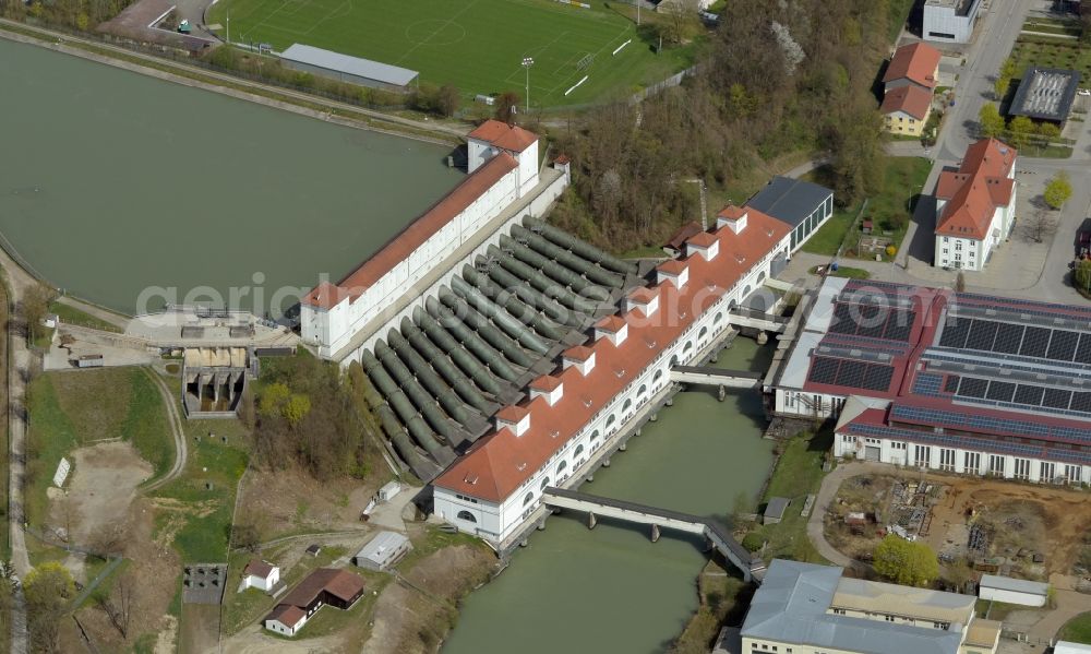 Töging am Inn from the bird's eye view: Building and dams of the waterworks and hydroelectric power plant in Toeging am Innkanal in the state of Bavaria, Germany