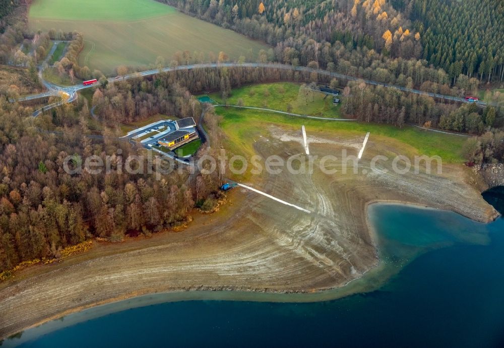 Aerial image Meschede - Low water level and lack of water caused the shoreline areas to be exposed of Hennesee in Meschede in the state North Rhine-Westphalia, Germany