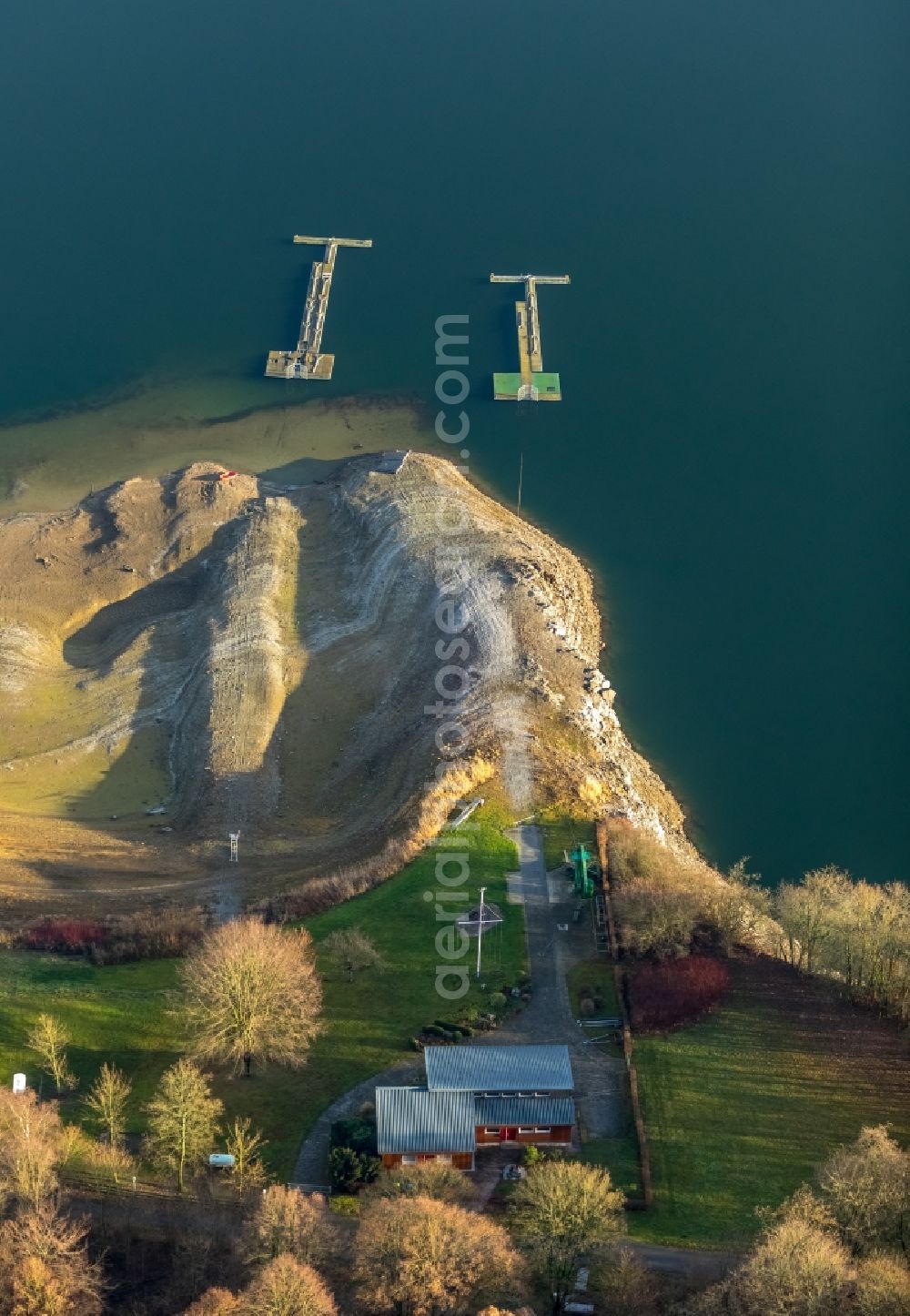 Aerial image Meschede - Low water level and lack of water caused the shoreline areas to be exposed of Hennesee in Meschede in the state North Rhine-Westphalia, Germany