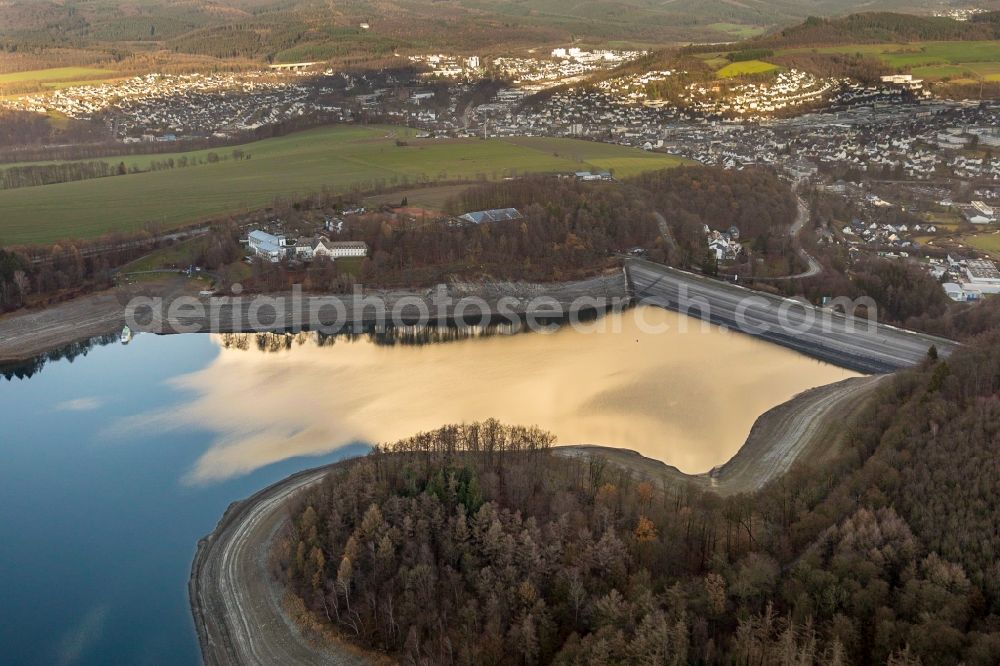 Meschede from above - Low water level and lack of water caused the shoreline areas to be exposed of lake Hennesee in Meschede in the state North Rhine-Westphalia, Germany