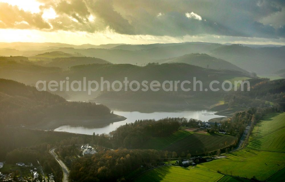 Meschede from above - Low water level and lack of water caused the shoreline areas to be exposed of lake Hennesee in Meschede in the state North Rhine-Westphalia, Germany