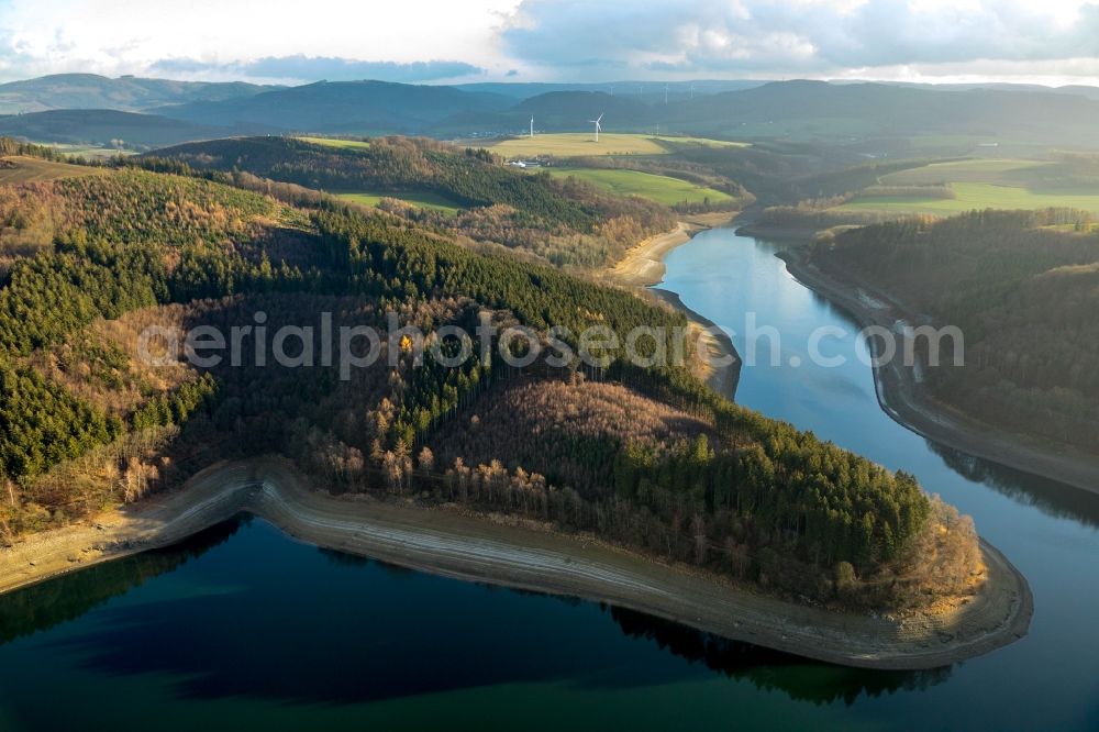 Meschede from the bird's eye view: Low water level and lack of water caused the shoreline areas to be exposed of lake Hennesee in Meschede in the state North Rhine-Westphalia, Germany