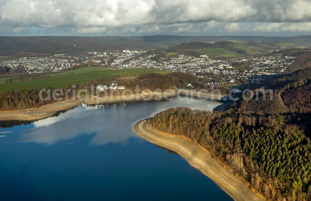 Aerial image Meschede - Low water level and lack of water caused the shoreline areas to be exposed of lake Hennesee in Meschede in the state North Rhine-Westphalia, Germany