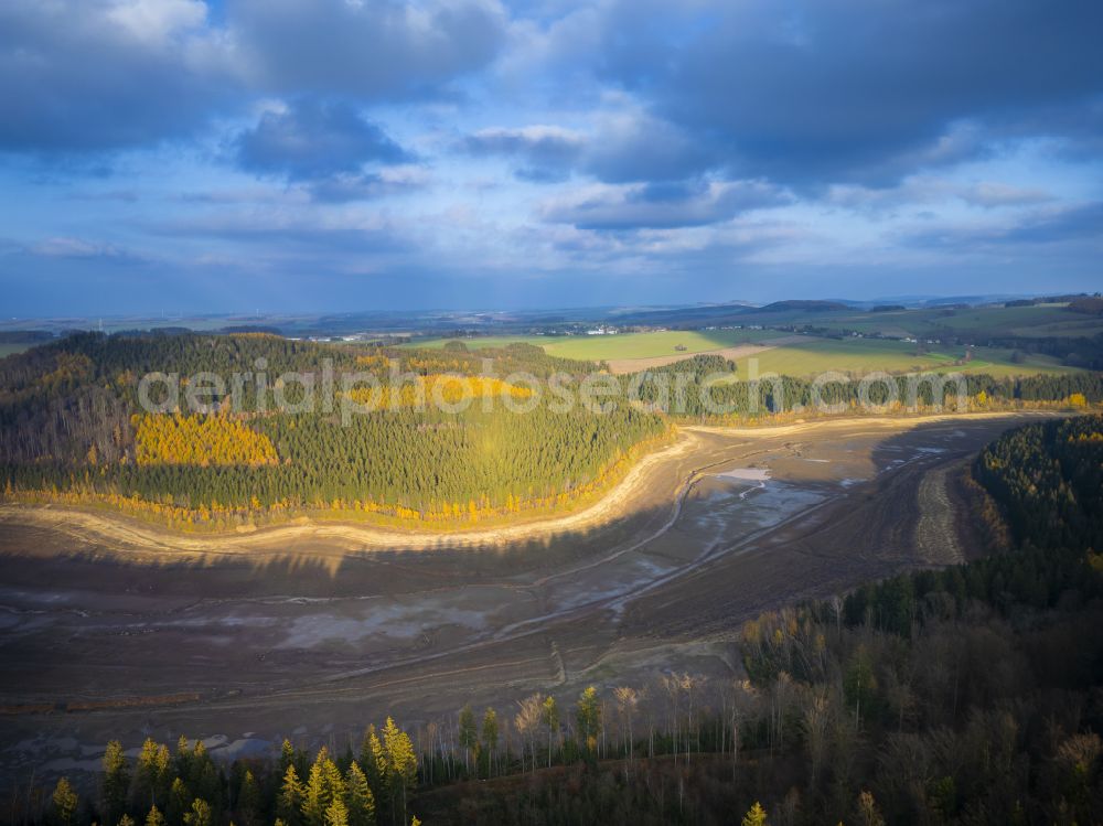 Aerial image Lichtenberg/Erzgebirge - Exposing the banks of the Lichtenberg Dam in Lichtenberg/Erzgebirge in the state of Saxony, Germany, for maintenance and repair purposes with controlled water discharge