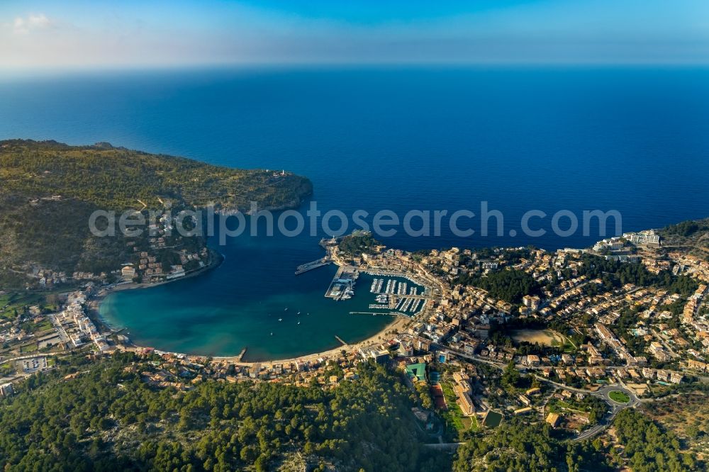 Aerial image Port de Soller - Water surface at the bay along the sea coast Balearic Sea in Port de Soller in Balearic Islands, Spain