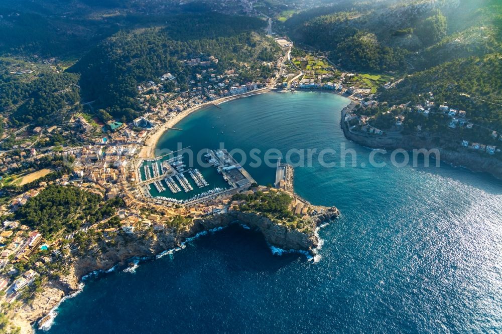 Aerial image Port de Soller - Water surface at the bay along the sea coast Balearic Sea in Port de Soller in Balearic Islands, Spain