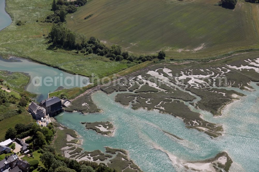 Saint-Briac-sur-Mer from the bird's eye view: Water surface at the bay along the sea coast at Saint-Briac-sur-Mer in Brittany, France. Left in the picture a former tidal mill